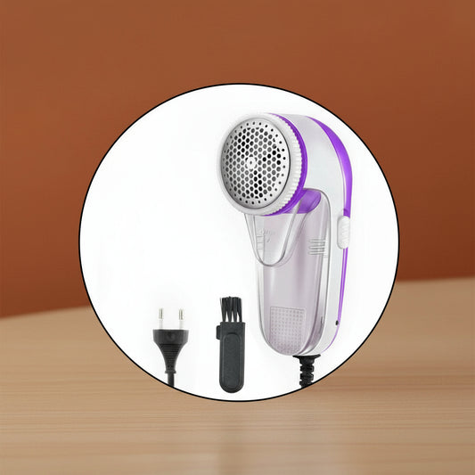 Handheld hair dryer with attachments on a brown background