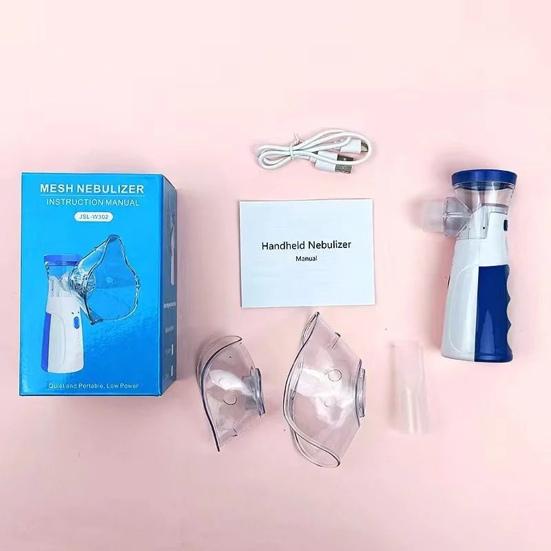 Handheld nebulizer with accessories on a pink background
